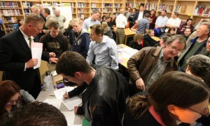Crowds of people fill out precinct forms, paw over piles of political pamphlets and get informed at a Republican caucus meeting at the North Davis Preparatory Academy in Layton Tuesday, March 23, 2010. Brian Nicholson, Deseret News